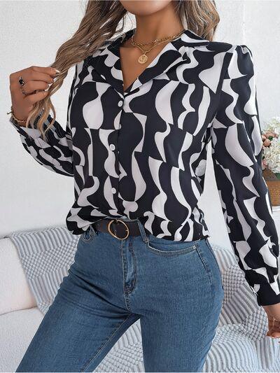 a woman wearing a black and white shirt and jeans