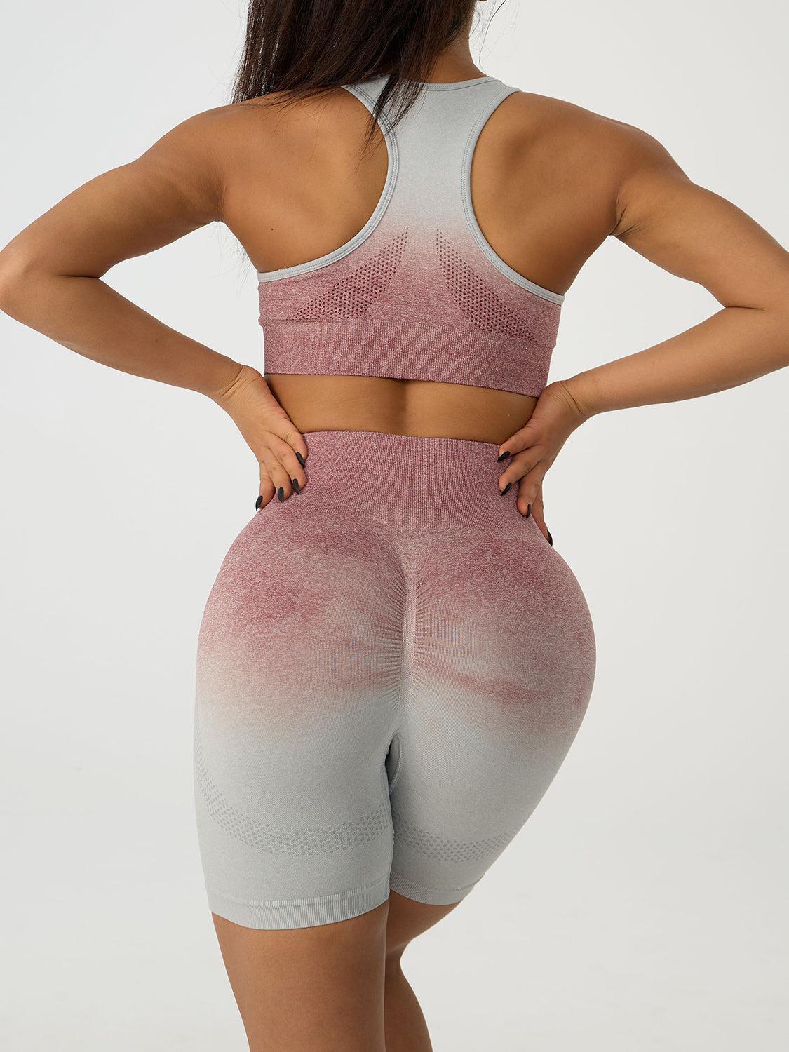 the back of a woman in a pink and white sports bra top