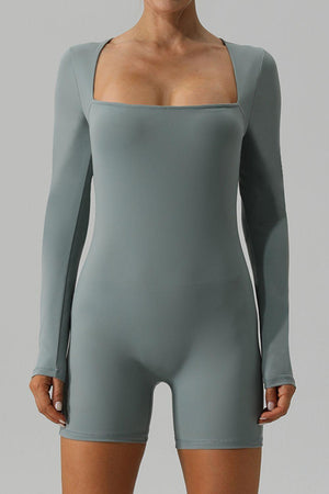 a woman in a bodysuit posing for a picture