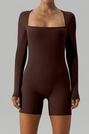 a woman wearing a brown bodysuit with long sleeves