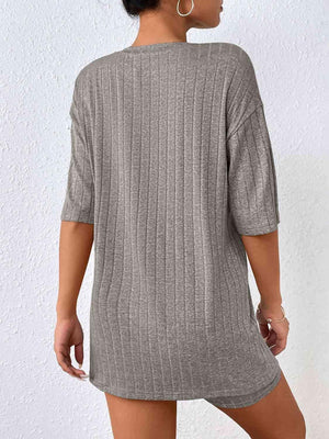 a woman wearing a gray sweater dress