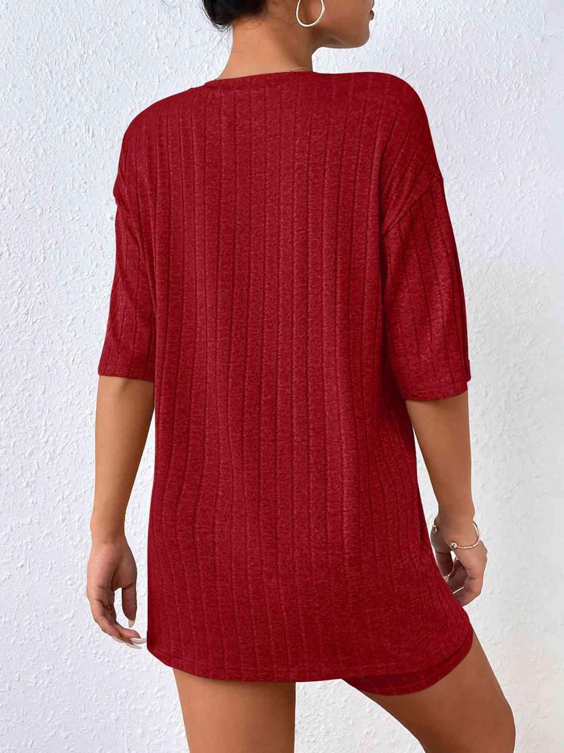 a woman wearing a red sweater dress