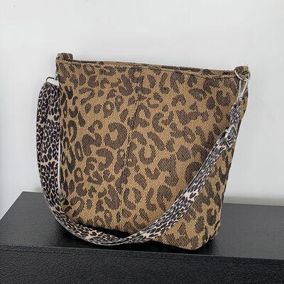 a leopard print purse sitting on top of a table
