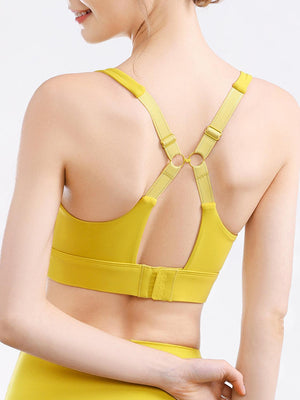 a woman in a yellow sports bra top