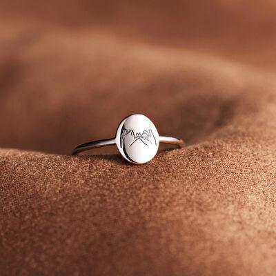 a close up of a ring on a cushion