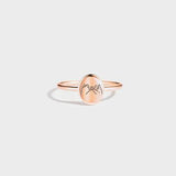 a rose gold ring with the word mom engraved on it