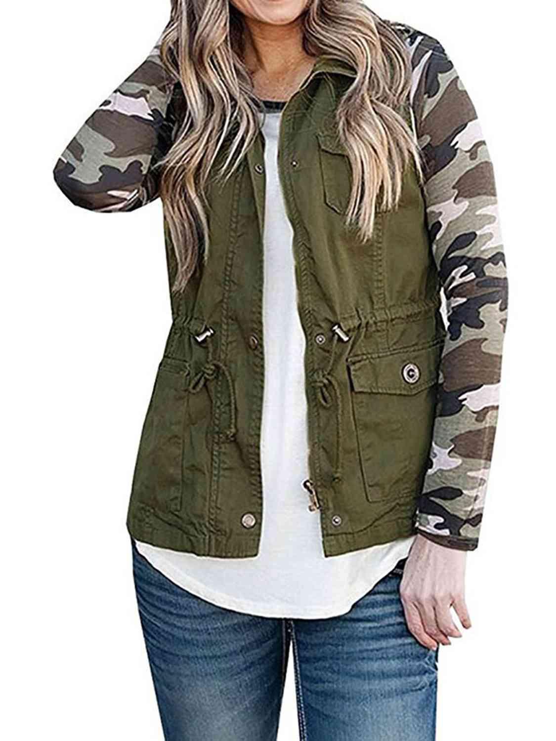a woman wearing a camo jacket and jeans