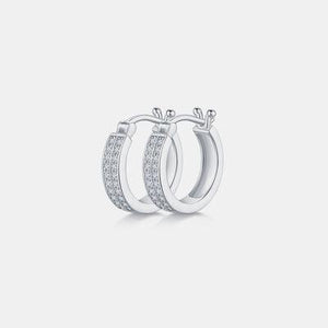 a pair of hoop earrings with diamonds
