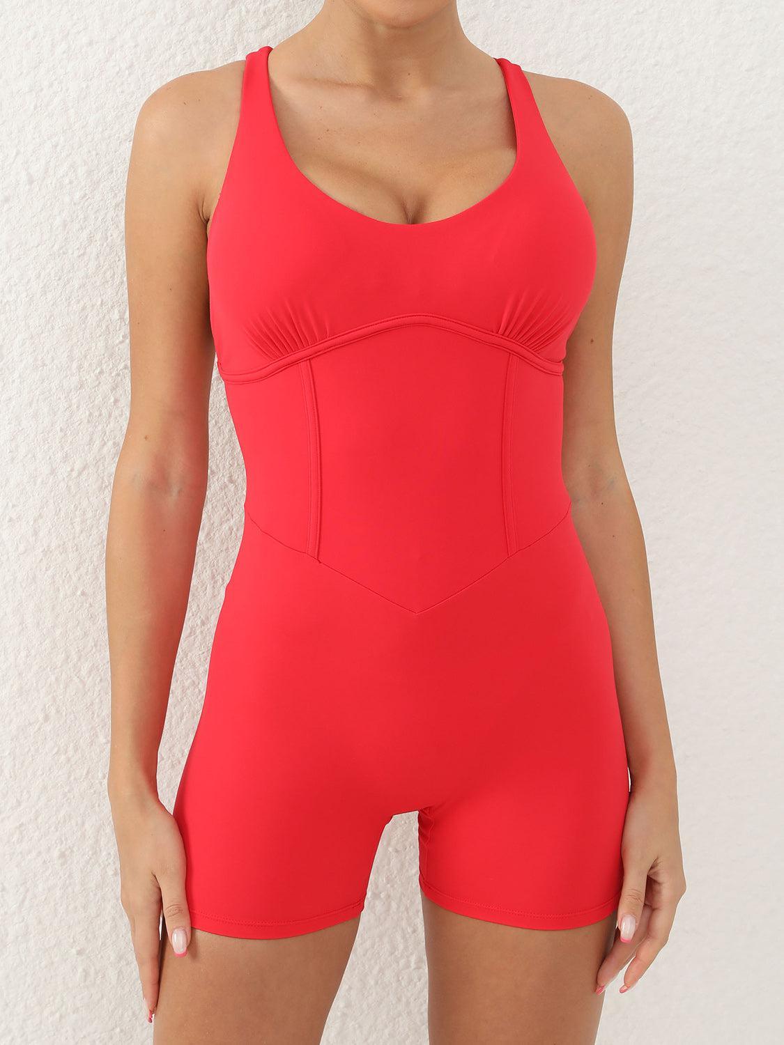 a woman in a red swimsuit posing for a picture