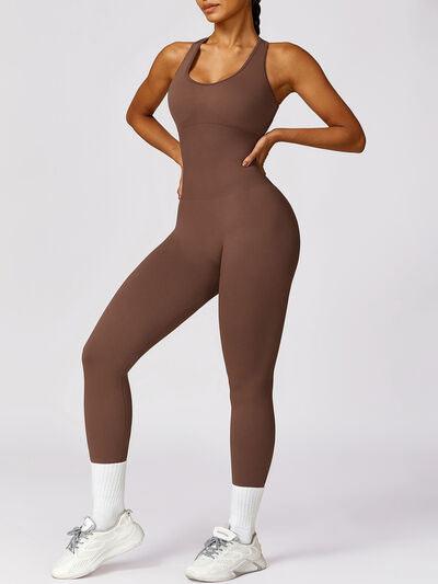 a woman wearing a brown bodysuit and white sneakers