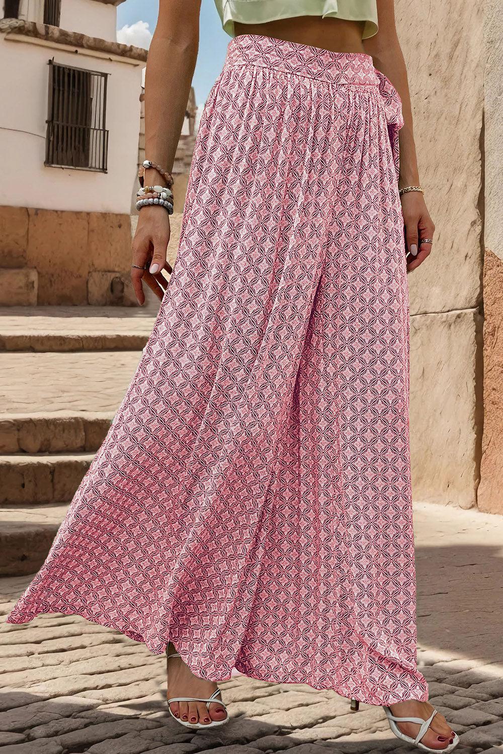 a woman wearing a pink and white patterned skirt