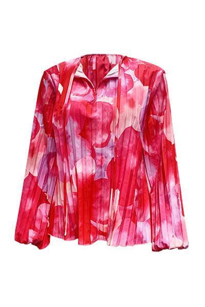 a pink blouse with a flower pattern on it