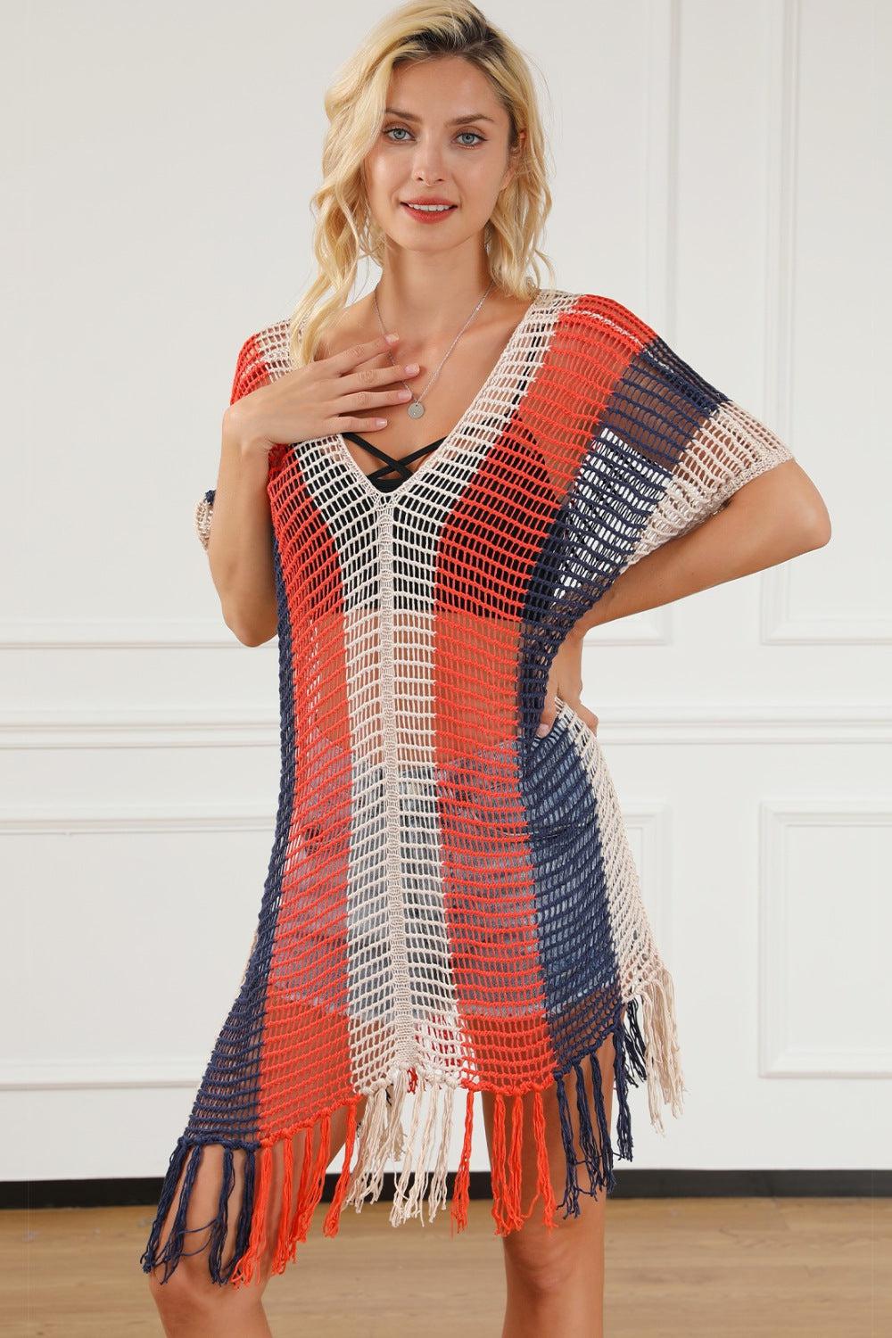 a woman standing in a room wearing a red, white, and blue croche