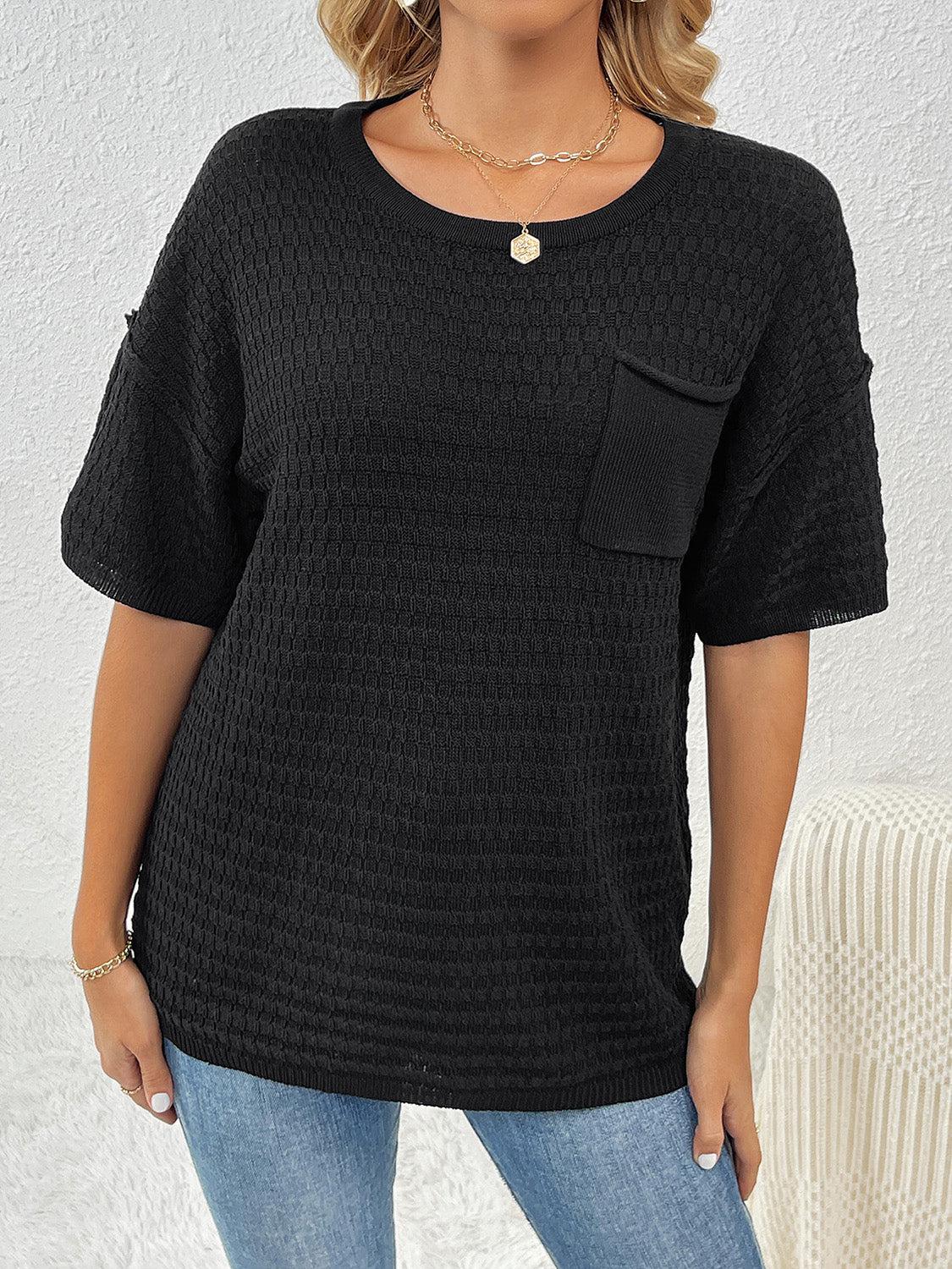 a woman wearing a black top with a pocket