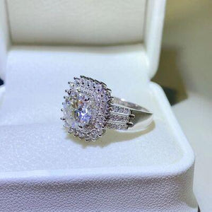 a diamond ring sitting on top of a white box