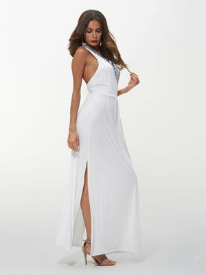 a woman wearing a white dress with a slit