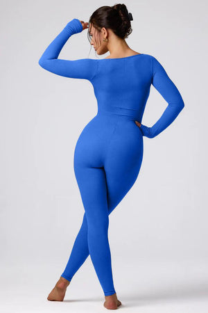 a woman in a blue bodysuit