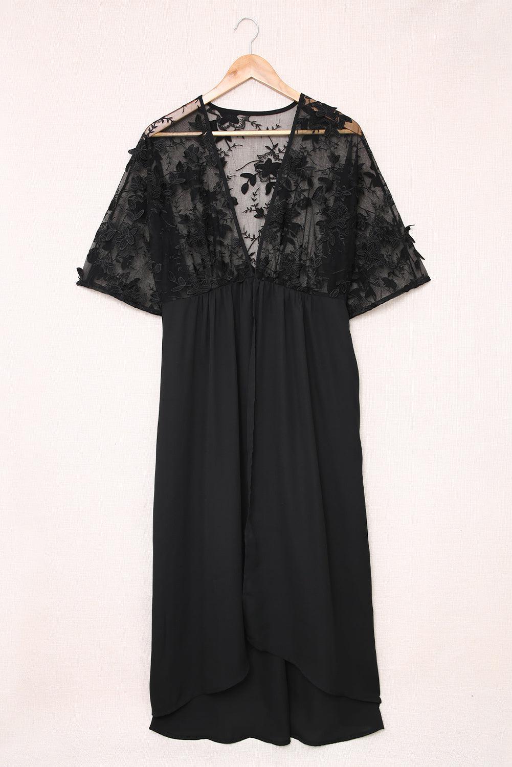 a black dress hanging on a hanger