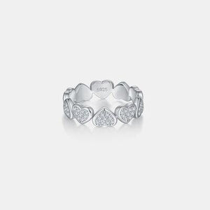 a white gold ring with hearts and diamonds