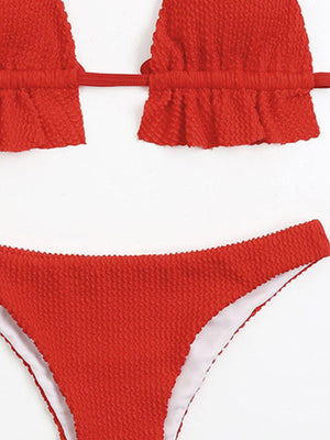 a woman's bikini top and bottom in red