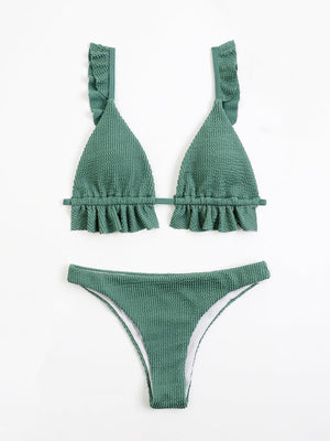 a green bikini top and bottom with ruffles