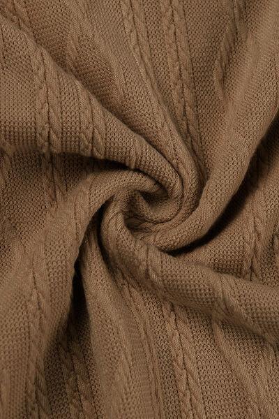 a close up view of a brown sweater