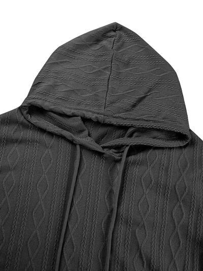 a black jacket with a hoodie on it