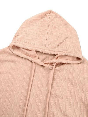 a pink sweater with a hoodie on top of it