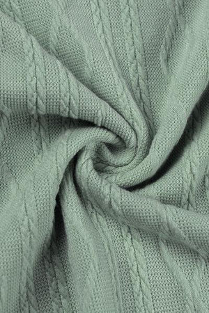 a close up view of a green sweater