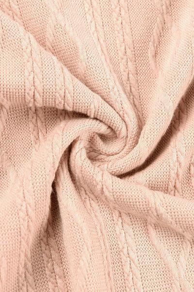 a close up of a pink sweater