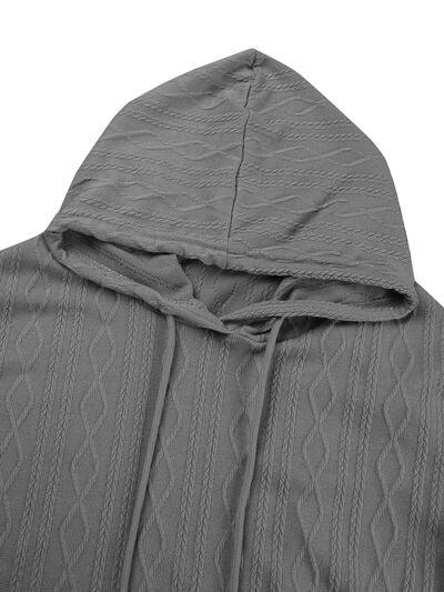 a gray sweater with a hoodie on top of it