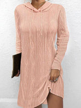 a woman wearing a pink sweater dress