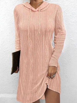 a woman wearing a pink sweater dress