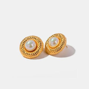 a pair of gold earrings with pearls