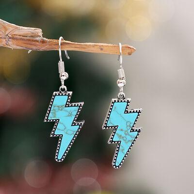 a pair of earrings with a turquoise and black design