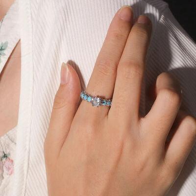 a close up of a person wearing a ring