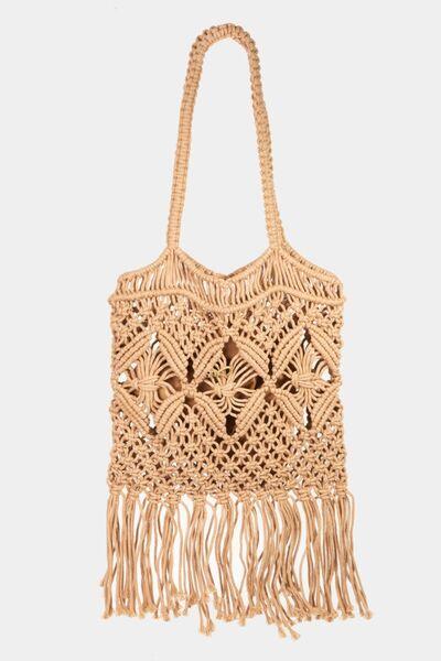 a straw bag with fringes hanging from it