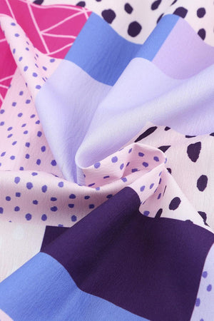 a close up of a colorful fabric with polka dots