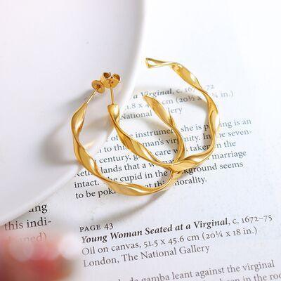 a close up of a book with a pair of gold rings