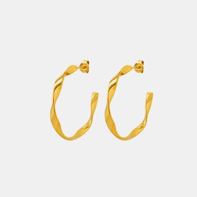 a pair of gold hoop earrings on a white background