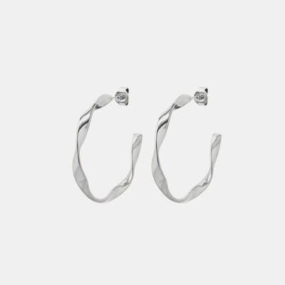 a pair of silver hoop earrings on a white background