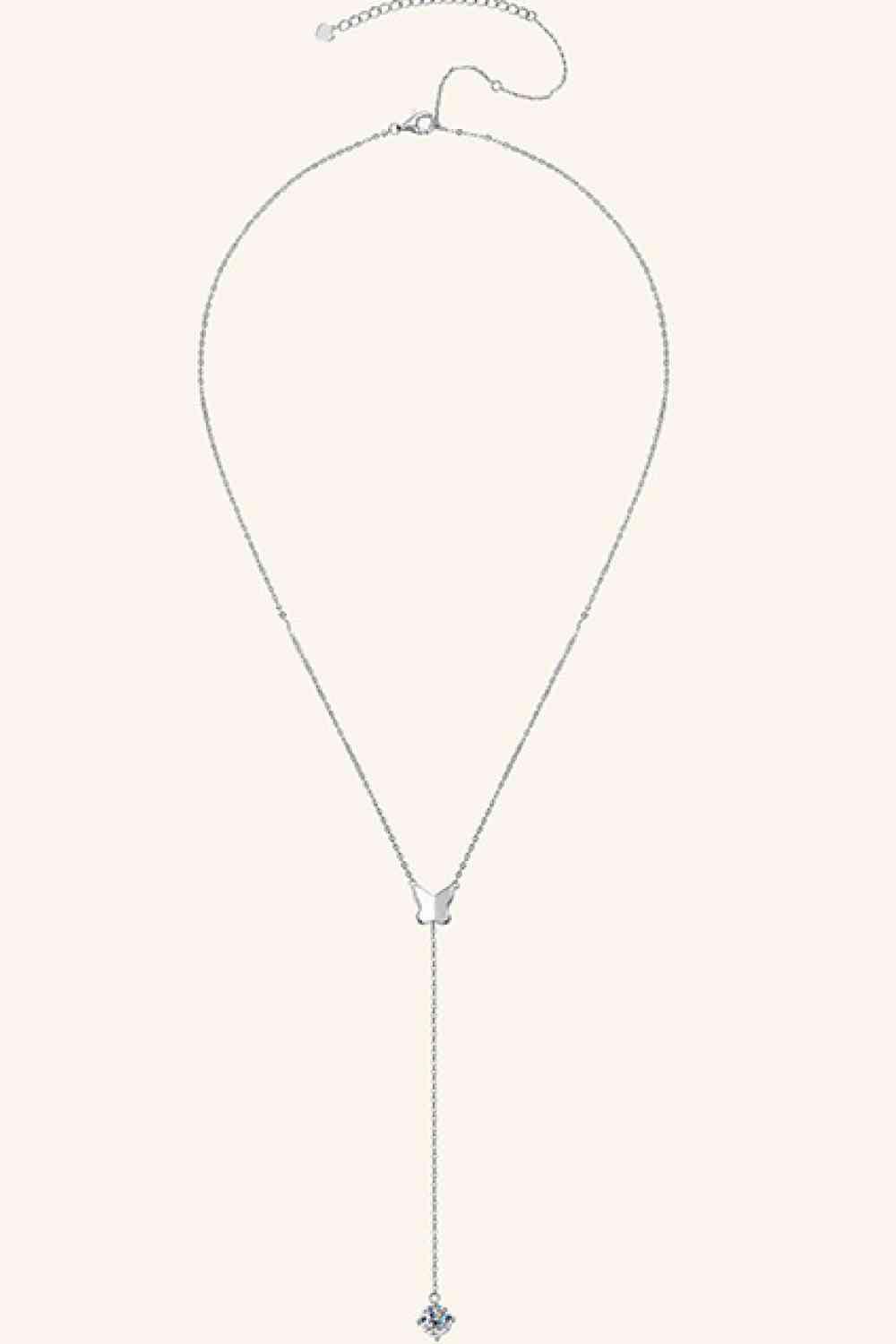 a white necklace with a cross on it