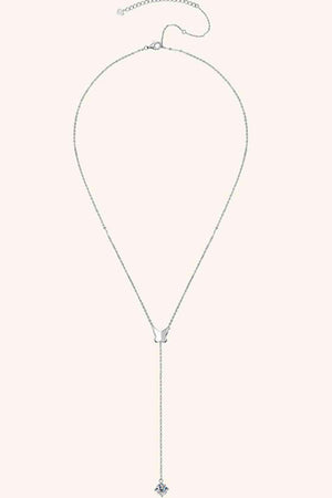 a white necklace with a cross on it
