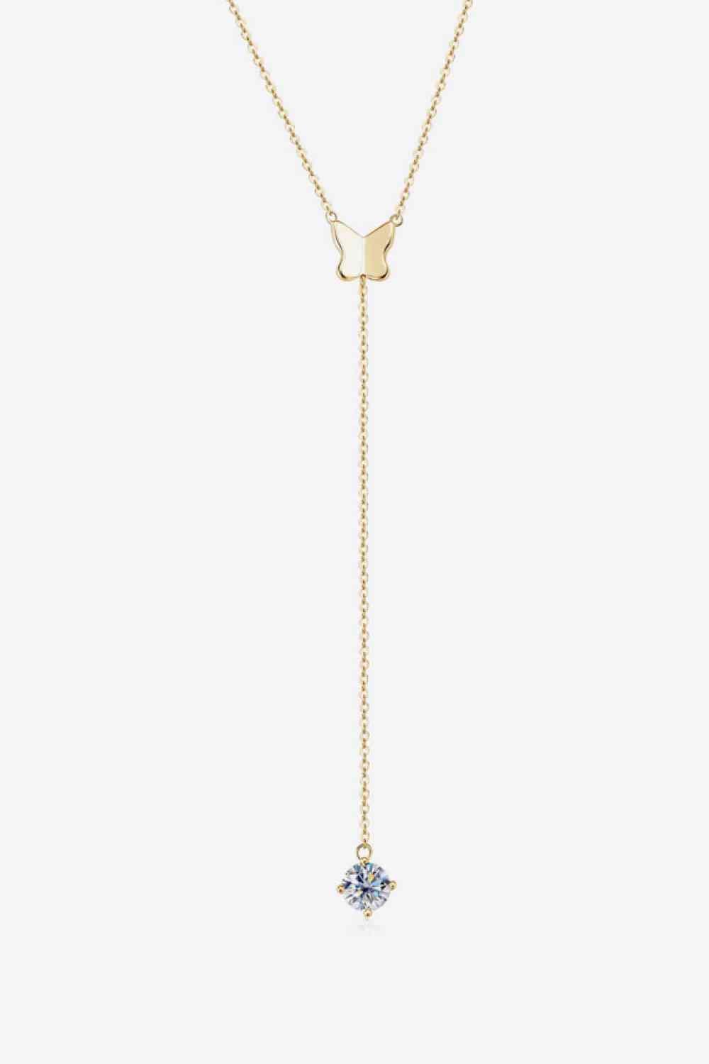 a gold necklace with a blue stone hanging from it