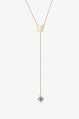 a gold necklace with a blue stone hanging from it