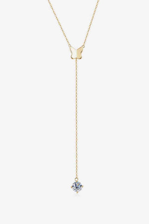 a gold necklace with a blue stone hanging from it