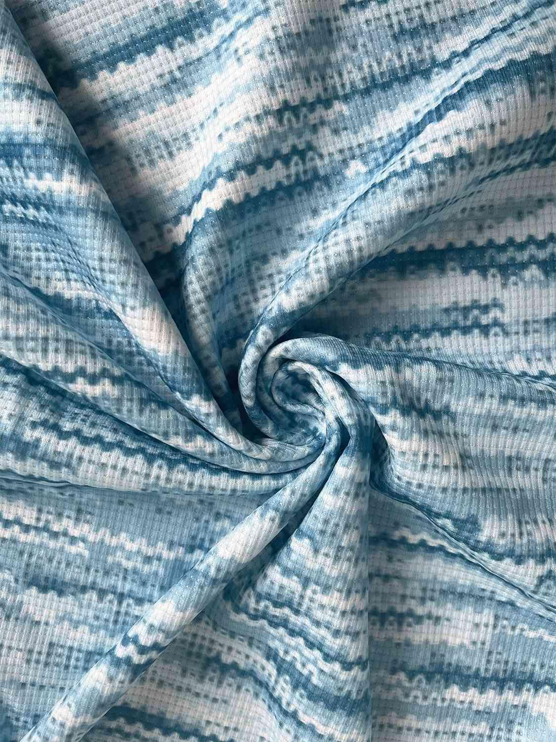 a close up of a blue and white fabric