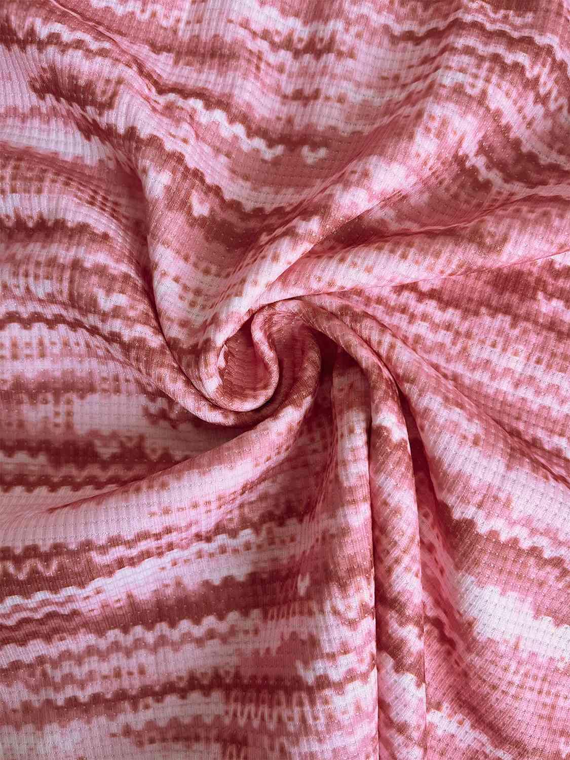 a close up of a pink and white striped fabric