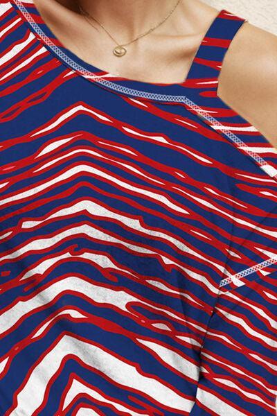 a woman wearing a red, white and blue striped top