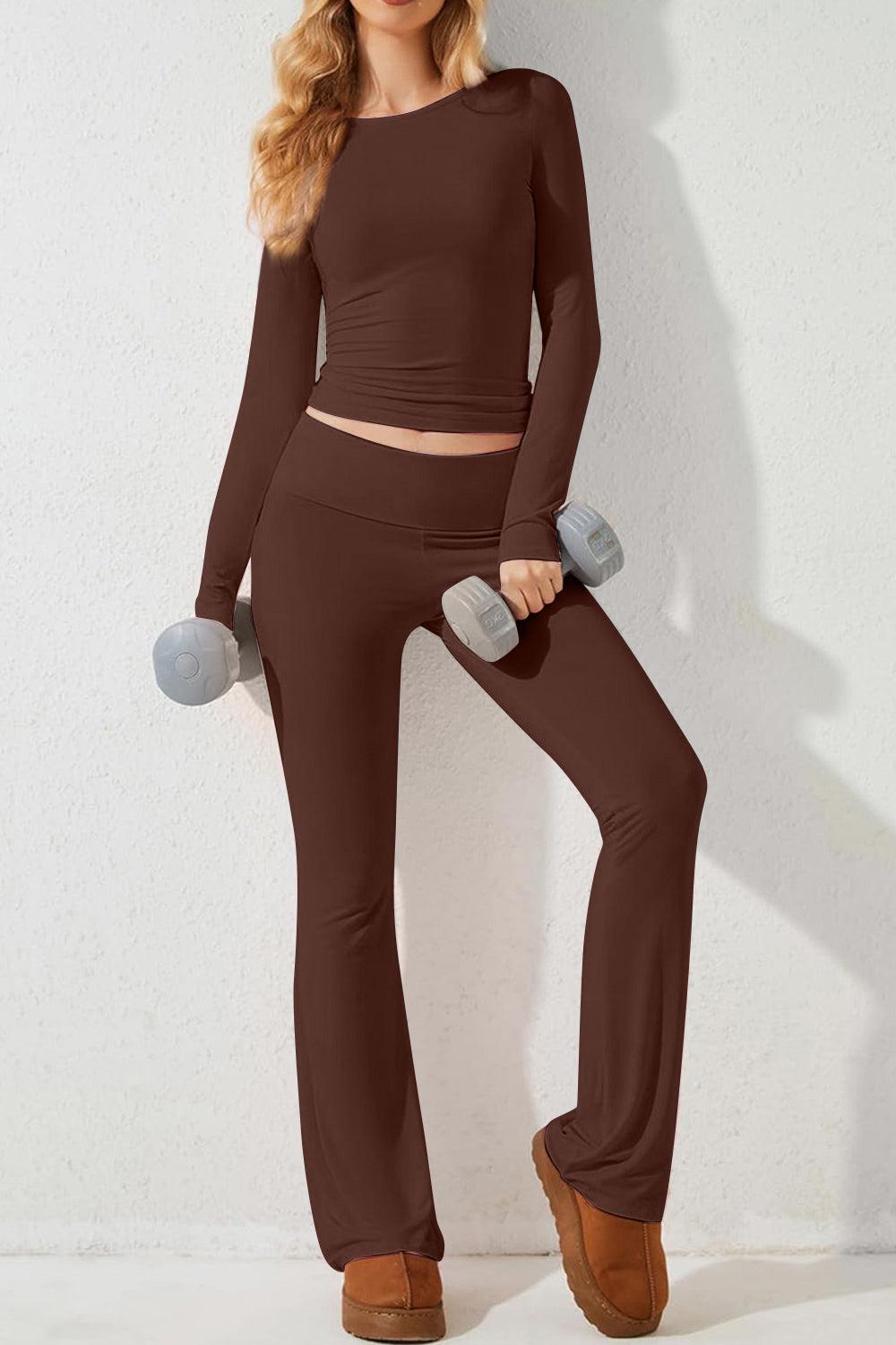 a woman in a brown top and brown pants